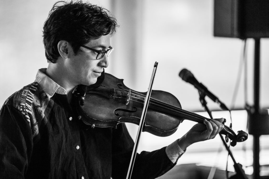 Jeffrey Young performing on violin at Omaha Under the Radar festival