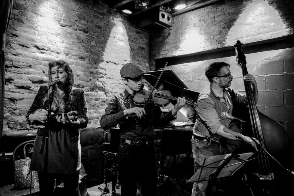 Black and white photo of Jeffrey Young performing with a band at Rockwood Music Hall