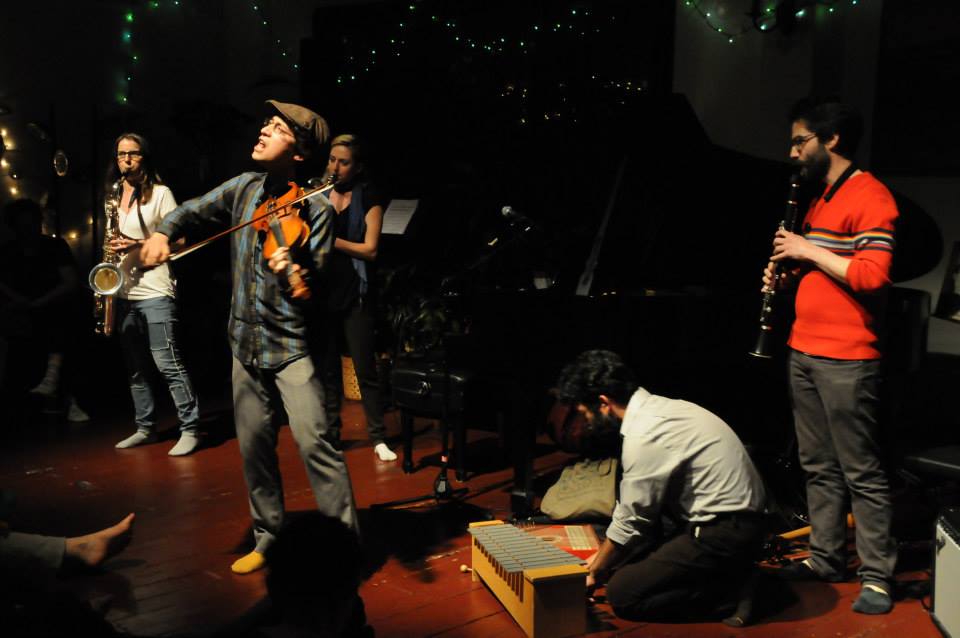 Jeffrey Young performing with members of thingNY and friends at an intimate salon-style venue in Philadelphia, PA