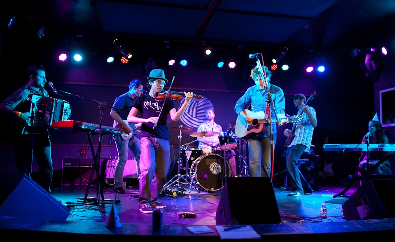 Jeffrey Young performing with the band Food Will Win the War at the Knitting Factory in Brooklyn, wearing a fedora and a T-shirt